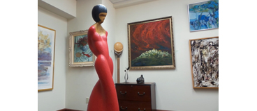 art gallery with sculpture and paintings